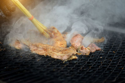 Close-up of meat on barbecue grill