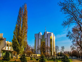 Low angle view of buildings against blue sky