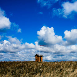 House on field against sky