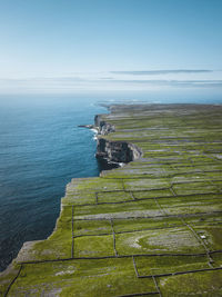 Inishmore of the aran islands with its typical stone walls and 100m high cliffs.