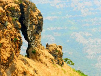 Rock formations on landscape against sky