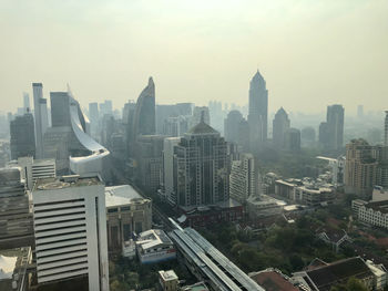 High angle view of buildings in city against clear sky