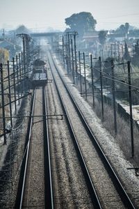 High angle view of railway tracks against sky in city