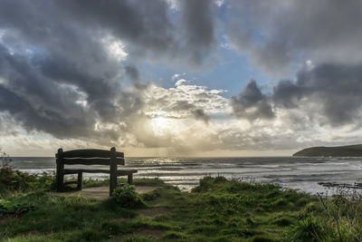 Scenic view of sea against storm clouds