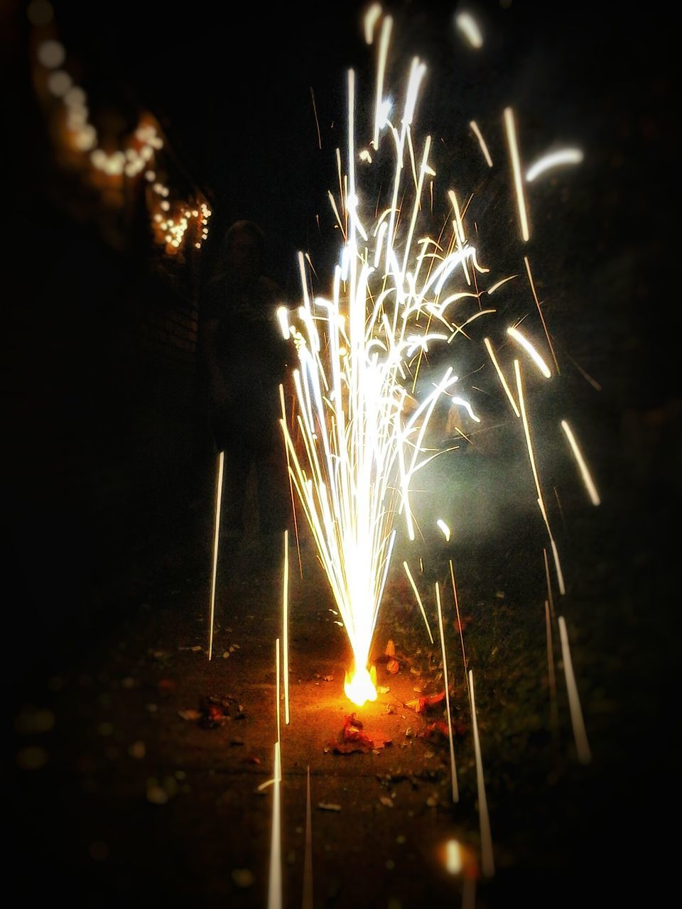 night, illuminated, long exposure, glowing, fire - natural phenomenon, sparks, motion, firework display, celebration, exploding, burning, firework - man made object, arts culture and entertainment, blurred motion, event, flame, firework, heat - temperature, entertainment, lit