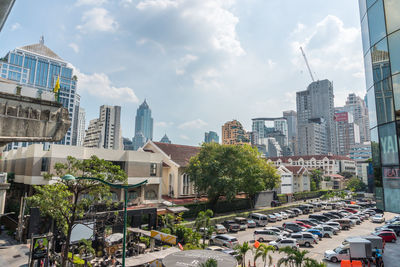 City street amidst buildings against sky