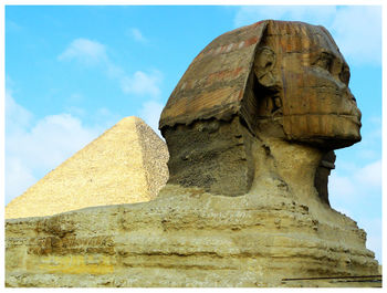 Low angle view of statue against sky