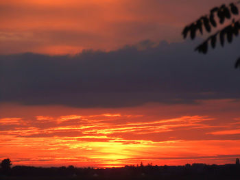 Low angle view of dramatic sky during sunset