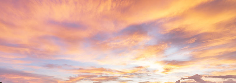 Low angle view of dramatic sky during sunset