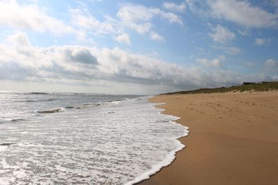 Scenic view of beach against sky