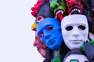 Close-up of masks for sale against white background