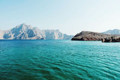 Scenic view of sea with mountains in background