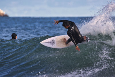 Man surfing on sea