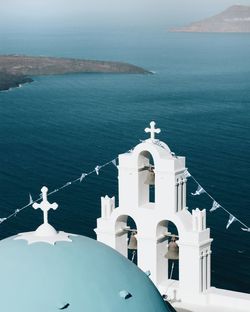 High angle view of white building by sea against sky