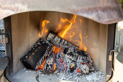 Burning wood in a fireplace with a lot of hot embers