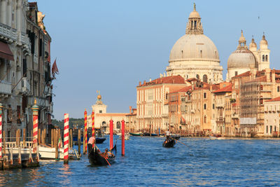 View of basilica with boats on canal