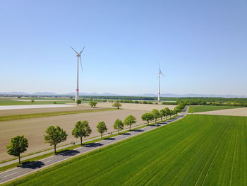 Scenic view of farm against clear sky