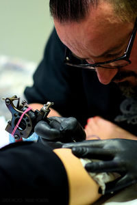 Close-up of man holding eyeglasses