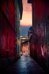 Narrow alley amidst buildings in city