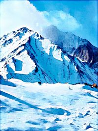 Snow covered landscape against blue sky