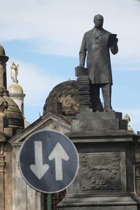 Low angle view of statue against sky