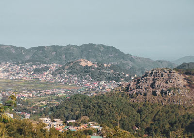 High angle view of buildings and mountains against sky