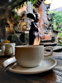 Close-up of coffee cup on table