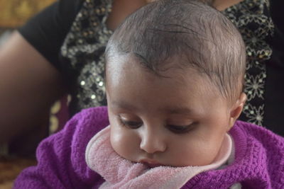Close-up of cute baby boy at home