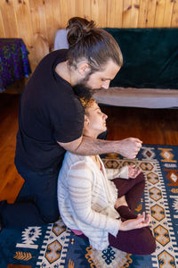 High angle view of mother and daughter at home