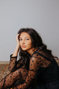 Portrait of a beautiful young woman over white background