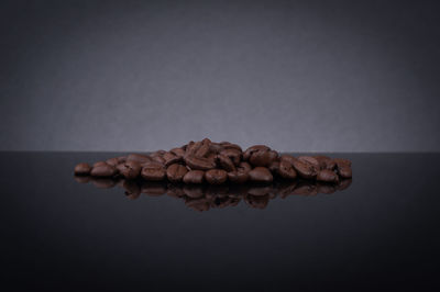 Close-up of food on table against black background