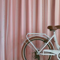 Close-up of bicycle against wall