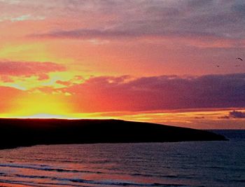 Scenic view of sea at sunset