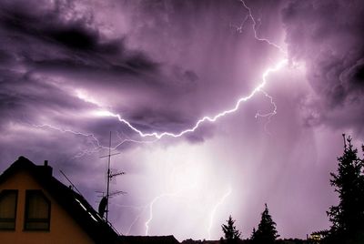 Low angle view of lightning in sky at night