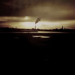 Scenic view of landscape against cloudy sky