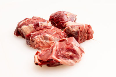 Close-up of meat on white background