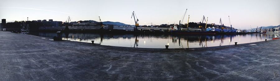 Scenic view of harbor against clear sky
