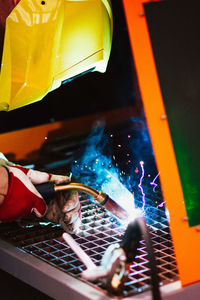 Close-up of welder working in metal factory