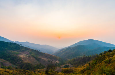 Scenic view of mountains against sky during sunset