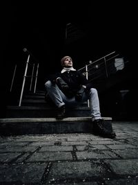 Man sitting on staircase