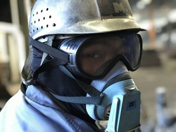 Close-up portrait of man wearing mask