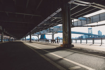 Manhattan bridge seen from walkway below elevated road