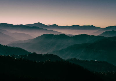 Scenic view of mountains at sunset