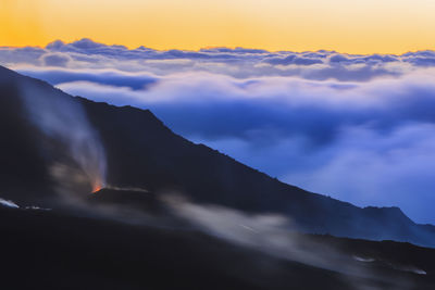 Low angle view of mountain against sky during sunset