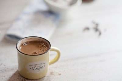 Close-up of coffee cup on table