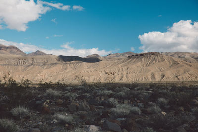 Scenic view of desert against blue sky