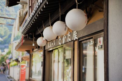 Low angle view of lanterns hanging in building