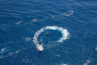 High angle view of sea against blue sky