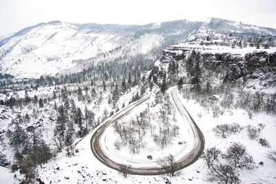 Scenic view of snow covered mountains against sky