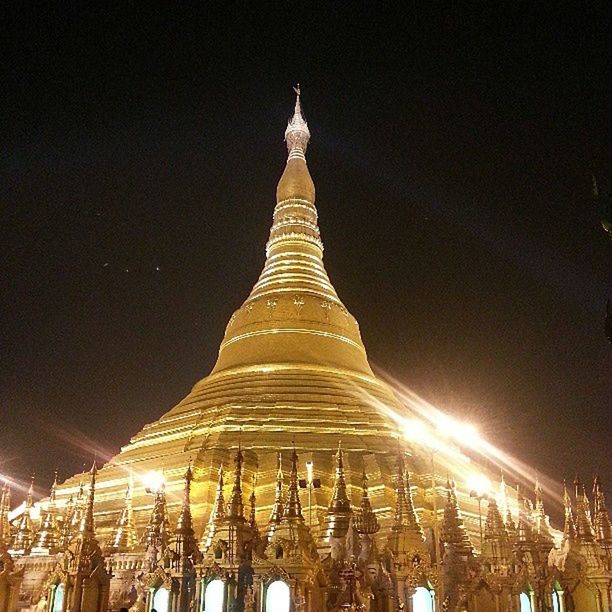 illuminated, night, architecture, built structure, famous place, travel destinations, tourism, religion, low angle view, international landmark, history, travel, place of worship, temple - building, sky, spirituality, building exterior, capital cities, outdoors, clear sky